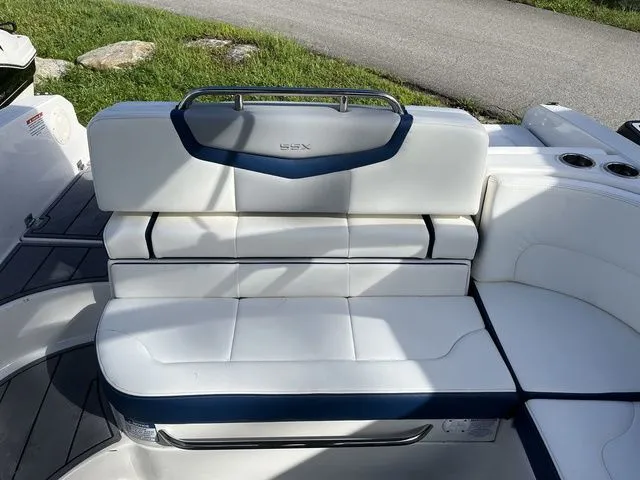 Slide: The Image of 2023 Chaparral 247 SSX boat seating with white and blue upholstery. - 12