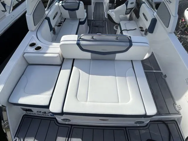 Slide: The Image of 2023 Chaparral 247 SSX boat interior with white seating and modern design. - 14