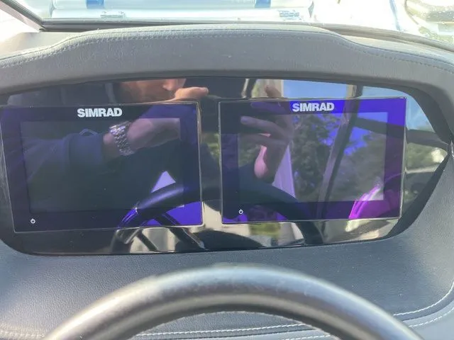Slide: The Image of Dashboard of 2023 Chaparral 247 SSX with dual Simrad displays. - 19