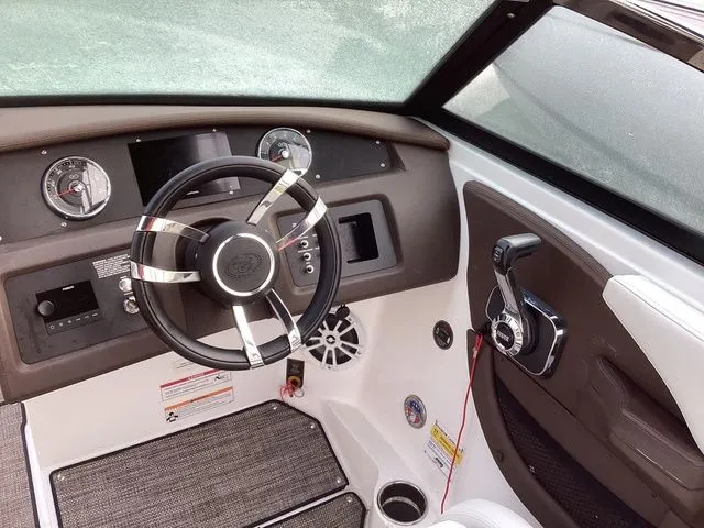 Slide: The Image of 2024 Cobalt CS22 boat dashboard with steering wheel and control panel. - 3