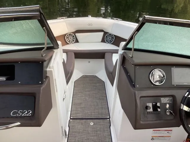 Slide: The Image of 2024 Cobalt CS22 boat interior with modern dashboard and seating. - 5