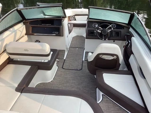 Slide: The Image of 2024 Cobalt CS22 boat interior with modern seating and dashboard design. - 7