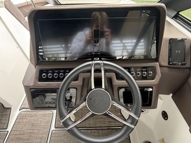 Slide: The Image of 2024 Cobalt R4 boat dashboard with steering wheel and digital display. - 8