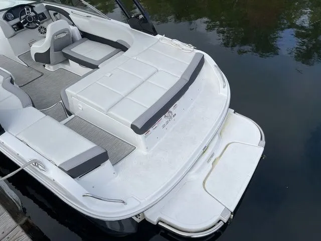 Slide: The Image of 2024 Cobalt 220S boat with spacious seating and swim platform on calm water. - 19