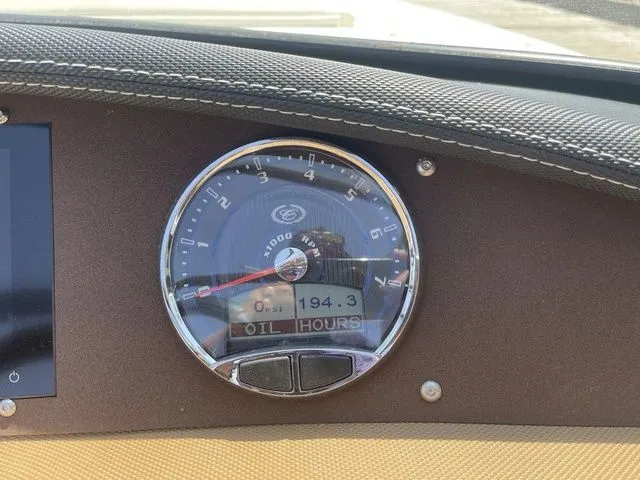 Slide: The Image of Dashboard of a 2022 Cobalt CS23 boat showing RPM gauge and oil hours. - 11