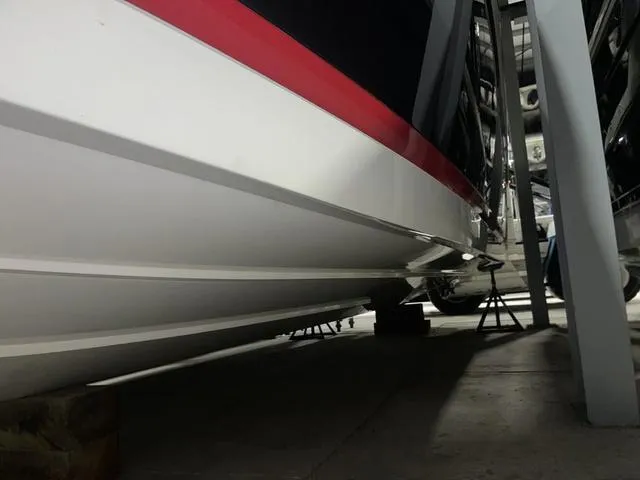 Slide: The Image of 2019 Cobalt R30 boat hull in storage, side view. - 17