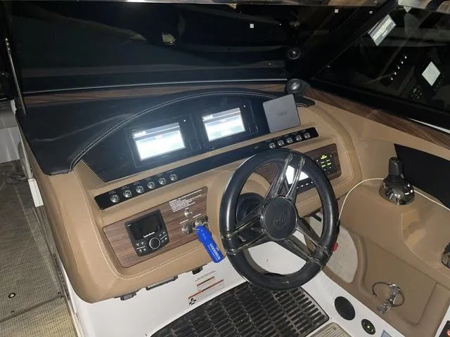 Slide: The Image of 2019 Cobalt R30 boat dashboard with steering wheel and digital displays. - 19