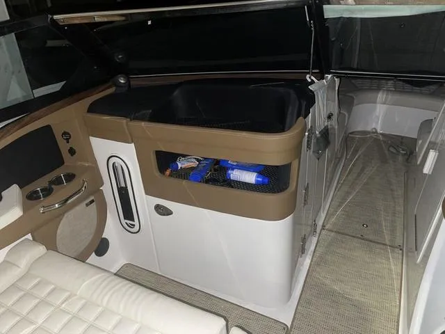 Slide: The Image of 2019 Cobalt R30 boat interior with seating and storage compartments. - 21