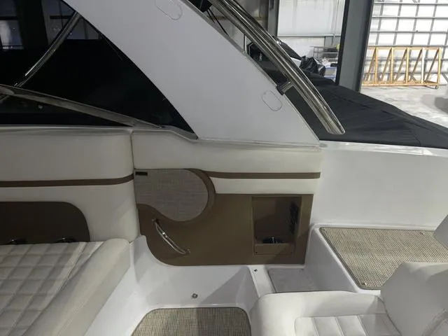 Slide: The Image of 2019 Cobalt R30 boat interior with white and beige seating, modern design. - 25