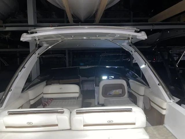 Slide: The Image of 2019 Cobalt R30 boat interior with white seating and modern design. - 27