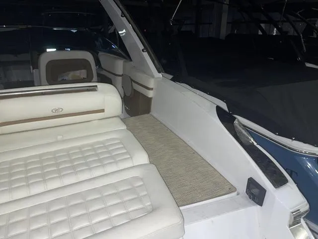 Slide: The Image of 2019 Cobalt R30 boat interior with white cushioned seating and sleek design. - 29