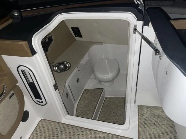 Slide: The Image of 2019 Cobalt R30 boat interior with compact bathroom and sink. - 31