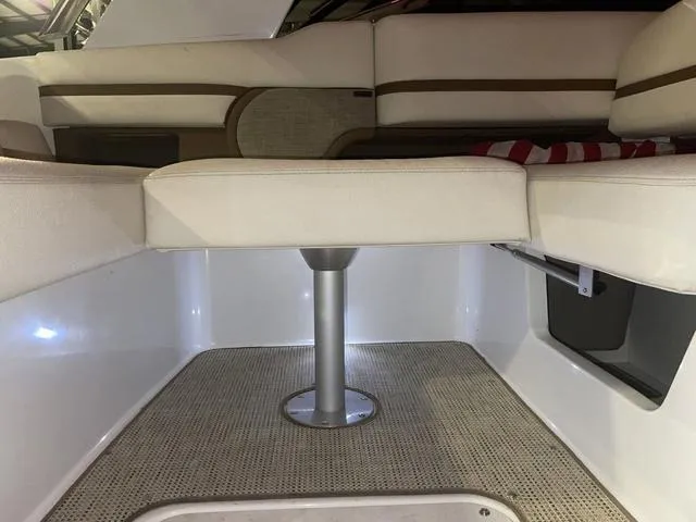 Slide: The Image of 2019 Cobalt R30 boat interior with cushioned seating and carpeted flooring. - 37