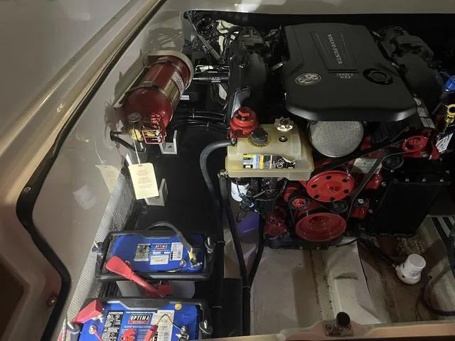 Slide: The Image of Engine compartment of a 2019 Cobalt R30 boat with batteries and fire extinguisher. - 38
