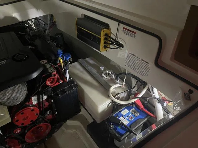 Slide: The Image of Engine compartment of a 2019 Cobalt R30 boat, featuring engine and battery components. - 39