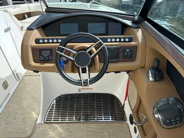 Slide: The Image of 2019 Cobalt R30 boat dashboard with steering wheel and control panel. - 4