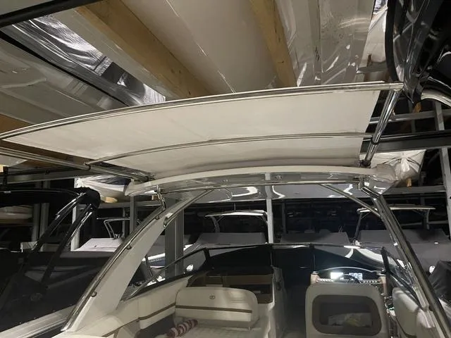 Slide: The Image of 2019 Cobalt R30 boat interior with canopy in storage facility. - 42