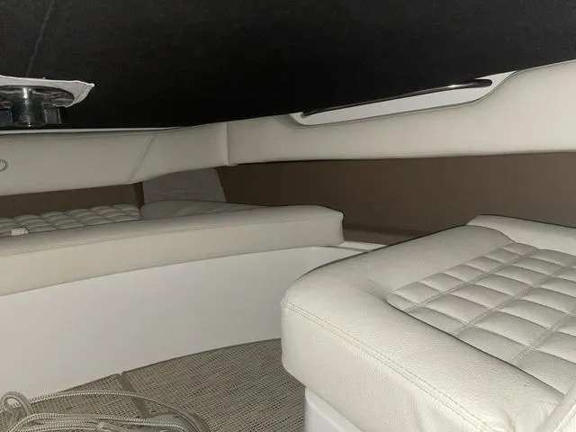 Slide: The Image of Interior cabin of a 2019 Cobalt R30 boat with cushioned seating. - 45