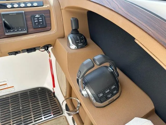 Slide: The Image of Control panel of a 2019 Cobalt R30 boat with joystick and throttle controls. - 5