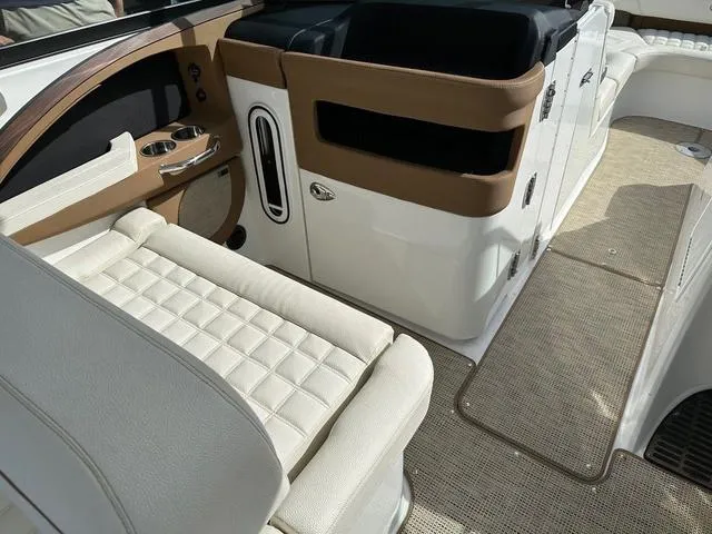 Slide: The Image of 2019 Cobalt R30 boat interior with beige seating and brown accents. - 6