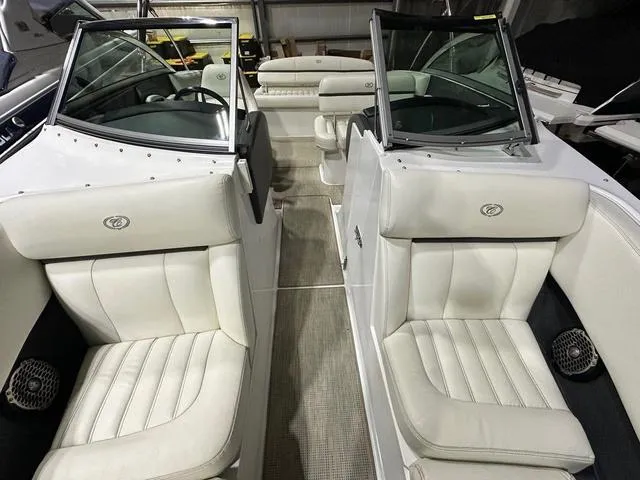 Slide: The Image of 2014 Cobalt R3 boat interior with white leather seats and open windshield. - 13