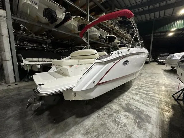 Slide: The Image of 2014 Cobalt R3 boat with red canopy in indoor storage facility. - 4