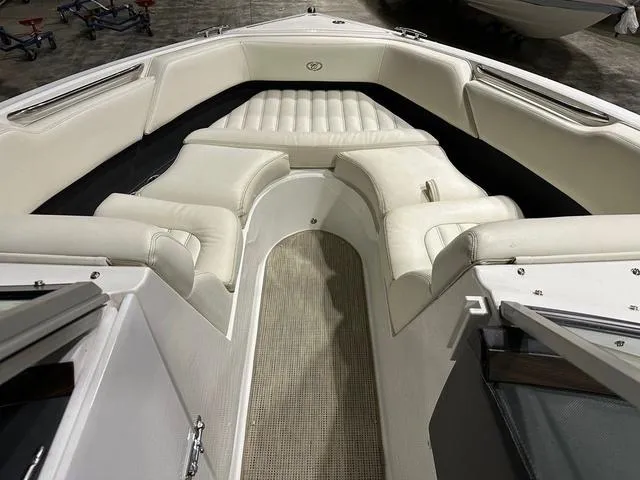 Slide: The Image of 2014 Cobalt R3 boat interior with white cushioned seating and carpeted floor. - 5