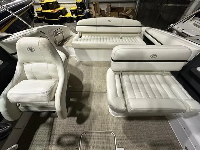 Slide: The Image of 2014 Cobalt R3 boat interior with white leather seating and carpeted flooring. - 8