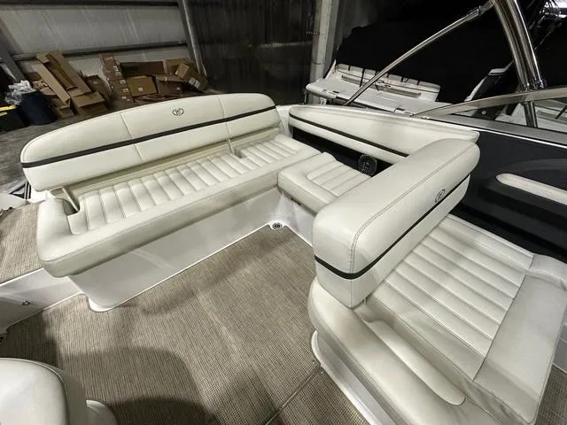 Slide: The Image of 2014 Cobalt R3 boat interior with white leather seating and carpeted flooring. - 9