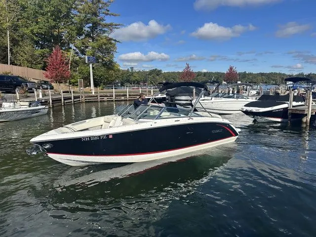 Slide: The Image of 2017 Cobalt R5 boat docked on a sunny day with clear skies and calm water. - 2