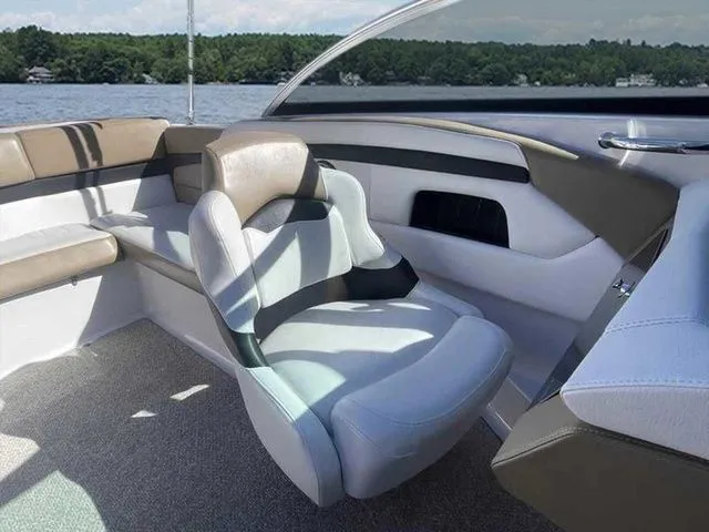 Slide: The Image of Interior of 2015 Four Winns H230 boat with plush seating and lake view. - 8