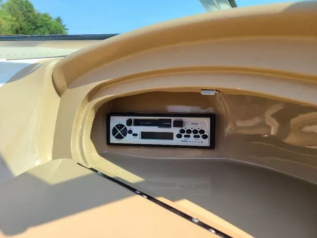 Slide: The Image of Radio system in 2000 Sea Ray 185BR boat dashboard, beige interior. - 7
