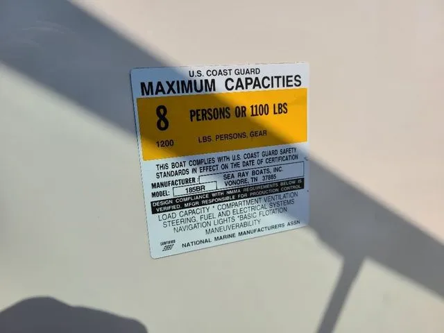 Slide: The Image of U.S. Coast Guard capacity label for 2000 Sea Ray 185BR, max 8 persons or 1100 lbs. - 8