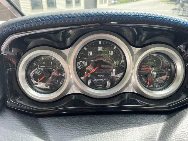 Slide: The Image of Dashboard of a 2021 MasterCraft XT22 boat with speedometer and gauges. - 10