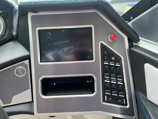 Slide: The Image of Control panel of a 2021 MasterCraft XT22 boat with touchscreen and buttons. - 11