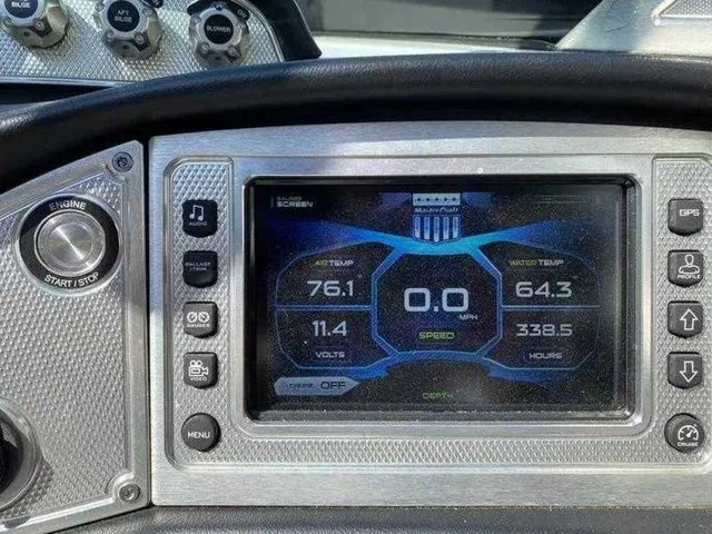 Slide: The Image of Dashboard of a 2014 MasterCraft X30 boat showing engine metrics and controls. - 25