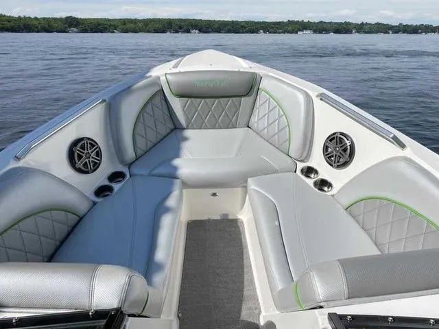 Slide: The Image of 2014 MasterCraft X30 boat interior with gray seating and lake view. - 7