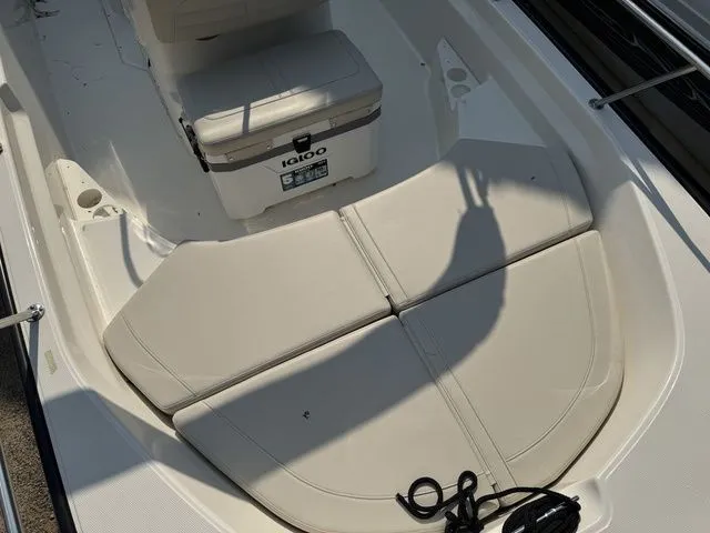 Slide: The Image of 2025 Boston Whaler 170 Montauk boat interior with seating and Igloo cooler. - 15