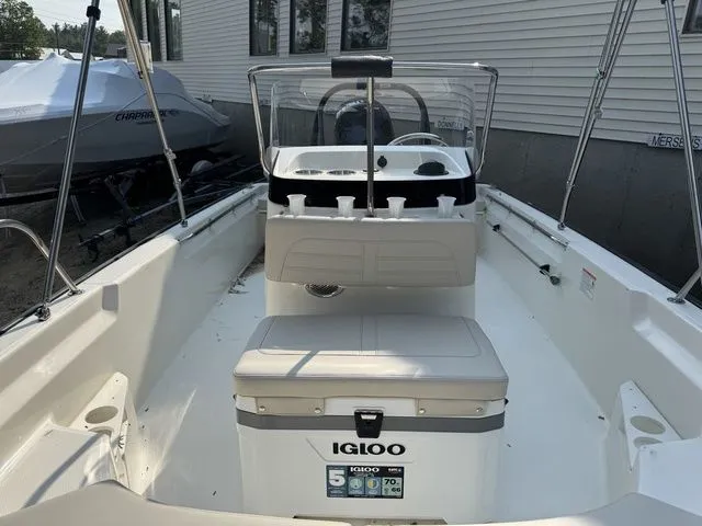 Slide: The Image of 2025 Boston Whaler 170 Montauk boat interior with Igloo cooler and console. - 17