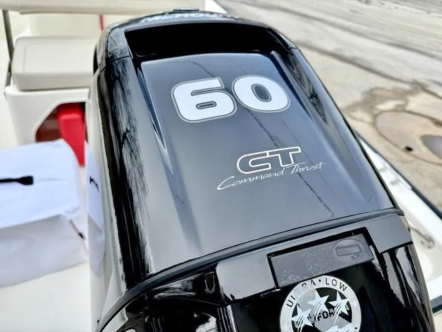 Slide: The Image of 2025 Boston Whaler 150 Montauk outboard motor, 60 HP Command Thrust, close-up view. - 7
