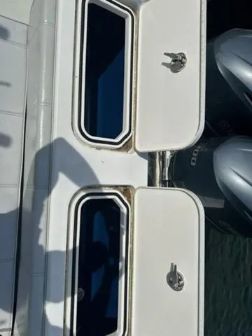 Slide: The Image of 2019 Contender 32ST boat with dual outboard engines and storage compartments. - 3