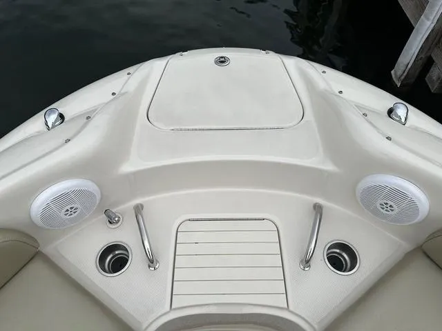 Slide: The Image of 2005 Sea Ray 240 Sundeck boat interior with speakers and cup holders. - 11