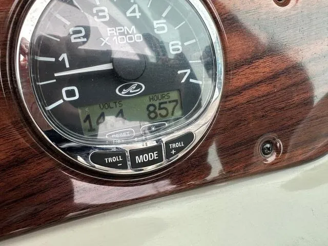 Slide: The Image of Close-up of 2005 Sea Ray 240 Sundeck dashboard showing RPM gauge and hour meter. - 18