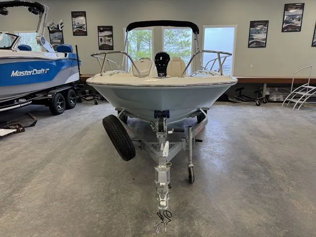 Slide: The Image of 2025 Boston Whaler 160 Super Sport boat on trailer in showroom. - 17