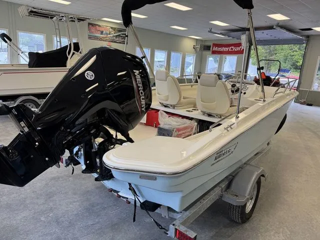 Slide: The Image of 2025 Boston Whaler 160 Super Sport boat with Mercury engine in showroom. - 4