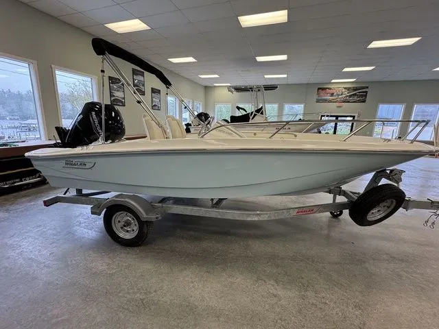 Slide: The Image of 2025 Boston Whaler 160 Super Sport boat on trailer in showroom. - 5