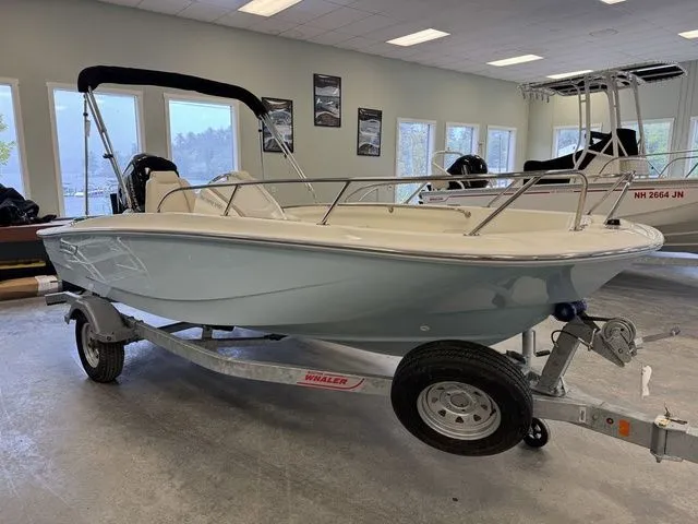 Slide: The Image of 2025 Boston Whaler 160 Super Sport boat on trailer in showroom. - 6