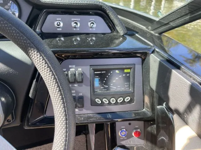 Slide: The Image of Dashboard of a 2023 MasterCraft NXT22 boat with control panel and display. - 10
