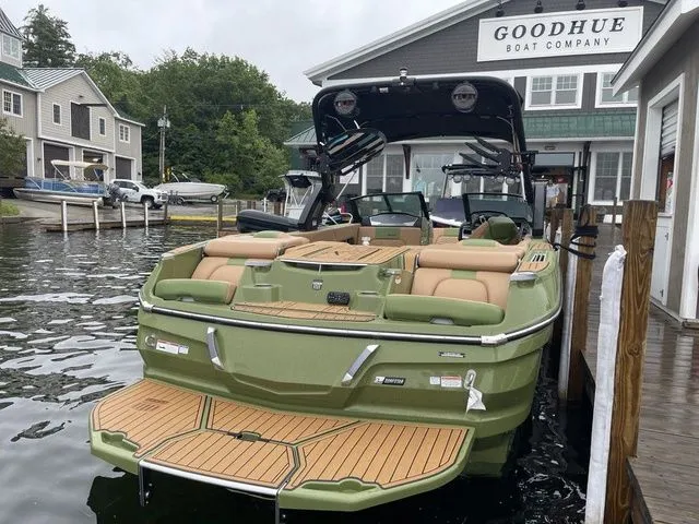 Slide: The Image of 2023 MasterCraft X24 boat docked at Goodhue Boat Company marina. - 3