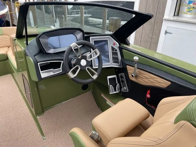 Slide: The Image of 2023 MasterCraft X24 boat interior with modern dashboard and steering wheel. - 8